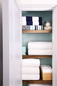 Take the door off your bathroom linen closet for a chic and open feeling check out an easy way to transform your bathroom closet by removing the door and creating an open storage nook with functionality and style to spare. How To Organize A Small Linen Closet Abby Lawson