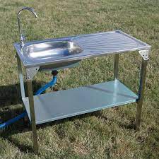 This is a hard plastic and it is removable, there is no drain. Camping Sink Outdoor Kitchen Sink Camping Sink Kitchen Sink Remodel