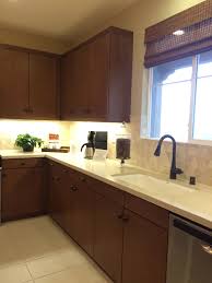 This will prevent the cabinets from looking like the sad loner in the room. Dark Kitchen Cabinets W Light Quartz Countertop Undermount Cast Iron Sink Dark Kitchen Dark Kitchen Cabinets Kitchen