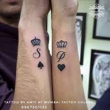 Beautiful Small King Queen Crown Symbol Along With Their Name Word Tattoo Done Big Guys Tattoo Tattoos Couple Tattoos Tattoos For Guys