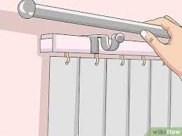 Once the panels are in place no one will know where the wall ends and the a: Simple Ways To Hang Curtains Over Vertical Blinds 13 Steps
