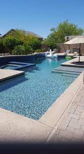 The curved house is a modern residence with distinctive lines conceived in plan as a u shaped form this residence features a courtyard that allows for a private retreat to an outdoor pool and a custom fire pit the master wing flanks one side of this central space while the living spaces a pool. Pin By Swimming Pool Quotes On Desert Lifestyle Pools In Az Beautiful Pools Building A Pool Swimming Pool Quotes