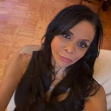 My grandmother died some weeks ago and this is the only picture of her  available. Can someone please change the background, keep her in a standing  position and as well change her