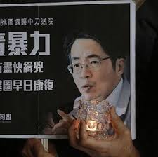 A protester holds a placard with a picture of former Ming Pao chief editor Kevin Lau (AP). The former editor of a Hong Kong newspaper whose abrupt dismissal ... - PANews_P-deab431d-f45b-4b87-ac57-0b3190309eb7_I1