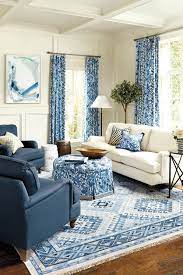 A storage coffee table can keep blankets and board games within easy reach without cluttering your space. 10 Living Rooms Without Coffee Tables How To Decorate Living Room Without Coffee Table Blue Living Room Sets Blue Living Room