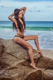 Welcome to gmbshair.com, the largest ethnic black beauty supply online. Sensual Brunette Woman In Gold And Black Bikini With Beautiful Stock Photo Picture And Royalty Free Image Image 69544014