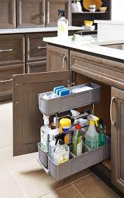 To clean wood kitchen cabinets, make a mixture of equal parts white vinegar and water. Organized Cleaning Supplies Inside Your Kitchen Cabinets Makes Tidying A B Cleaning Supplies Organization Small Kitchen Cabinet Storage Inside Kitchen Cabinets