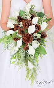 Incredibly beautiful bouquet on a pink fabric. Pine Cone Davids Bridal Wedding Bouquet Cascading Teardrop With Calla Lilies Greenery Fern Pin Bridal Wedding Flowers Pine Cone Wedding Bride Bouquets White