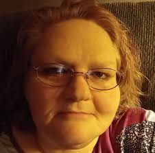 Who owns the car behind the barbershop next to Whites?