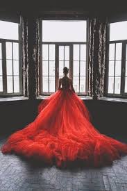 Woman Wearing Red Gown Looking Out Window Beautiful Dresses Beautiful Gowns Gowns
