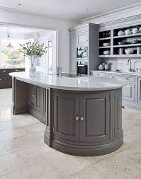 When you're rich enough to have a circular kitchen but not rich enough to have curved cabinet doors. Curved Grey Island Tom Howley