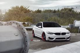 Alpine White Bmw F82 M4 Looks Aggressive With Red Accented Velos Wheels Bmw Bmw White Bmw Models