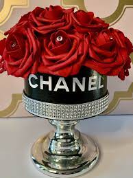 Red Roses In A Chanel Inspired Hat Box In 2021 Large Floral Arrangements Chanel Flower Red Roses