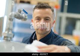 Portrait of man brewmaster with glass of beer Stock Photo