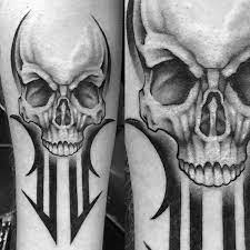 Some might choose to incorporate tribal tattoos into parts of larger pieces for an edgy accent. 50 Tribal Skull Tattoos For Men Masculine Design Ideas
