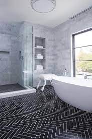 A farmhouse bathroom by dv rasmussen construction gets a chic touch with a subtle marble herringbone tile floor. Black Marble Herringbone Tile Bathroom Novocom Top