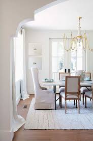 Typically, it has the sleekness of a modern style and the. Iron And Marble Dining Table With Gold Chandelier Transitional Dining Room