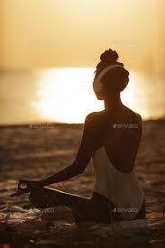 Woman In Yoga Meditation Pose With Headphones On The Beach In 2020 Yoga Meditation Poses Meditation Poses Yoga Meditation
