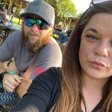 What is the usual down payment for a new or used car and how do monthly  payments work?