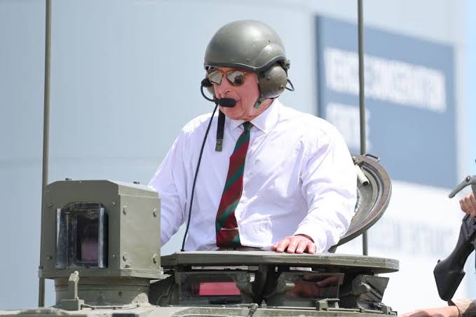 King armors up and rides a TANK as 'disappointed' Harry fires shots over Palace row ahead of UK visit
