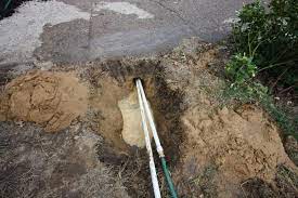 If you don't have any cracks and don't want to cut one with a masonry saw then you could water drill pvc conduit underneath the driveway. I Need To Get A Sprinkler Communications Wire Run Under My Driveway The Driveway Is Concrete And 12ft Across What Is The Best Way To Go About Running This Cable Under The
