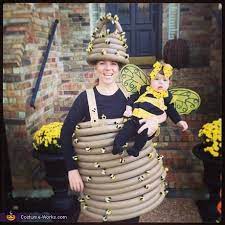 18 Creative Halloween Costumes For Parents And Baby Baby Bee Costume Halloween Costume Contest Old Halloween Costumes