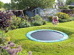 Sunken Trampoline Part Of A Family Garden Design Find Out More At Intogardens Into Gardens Com Sunken Trampoline Play Garden Large Backyard Landscaping