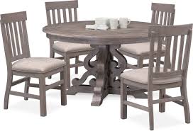 A welcoming, round farmhouse table draws the eye with its reclaimed wood top and a compelling architectural base in a rustic black olive finish. Charthouse Round Dining Table And 4 Side Chairs Value City Furniture