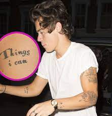 Mermaid tattoo represents rebirth, danger, and seduction. Harry Styles A Guide To His Tattoos Harry Styles Tattoos Harry Styles Face Harry Styles