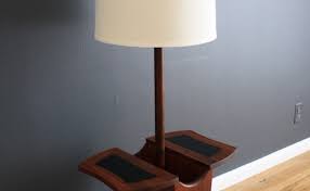 Combining a lower magazine rack, round top, and complementing lamp, this versatile and stylish wood end table has everything you need to outfit your favorite seating group or reading nook in style. 15 Floor Lamps With Table Attached The Buyer S Guide
