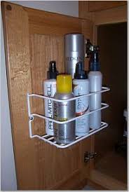 These Little Baskets Screw Right Into Cabinet Doors Extra Storage From Www Bathroom Cabinets Diy Bathroom Vanity Organization Bathroom Cabinet Organization