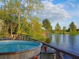 It seems too good to be true because uk heatwaves and log cabin holidays in the cotswolds don't always coincide, but reader, they did for me. Lakeside Log Cabins With Hot Tubs In The Cotswolds Travel With Kat