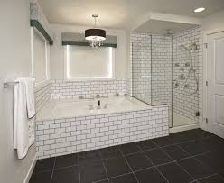 Black And White Tile Bathroom Shower Crisp White Subway Tile Accented With Dark Grout Surrounds The Tub And Enclosed Shower White Subway Tile Shower White Bathroom Tiles White Subway Tile Bathroom