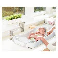 Just remove the newborn sling and add the baby stopper insert. The First Years Sure Comfort Deluxe Newborn To Toddler Tub With Sling Baby Bath Tub Newborn Baby Bath Tub Baby Bath