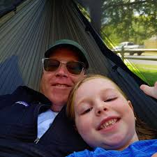 What backpack brands use ultra fabric and are lightweight, can carry 65L  primarily in the main body, and are comfortable with heavier loads?