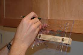If you're using the old hinges that are still attached to the base cabinet, hold the door up with the hinges extended to touch. How To Install Cabinet Door Hardware How Tos Diy