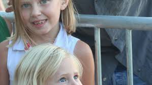 Volunteers and fans gather at the site