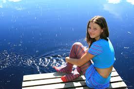 Sandra Orlow, women, model, women outdoors, bare midriff, looking at  viewer, Striped pantyhose, red pantyhose, lake, watermarked, sitting  backwards | 3504x2336 Wallpaper - wallhaven.cc