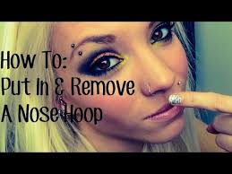 Continue thrusting the curved nose ring into the hole, turning it clockwise as you do so. How To Put In Take Out A Nose Hoop Youtube