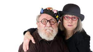 Senior Couple With Funny Hats Red Glasses And Silly Expressions Family Portraits Happy People Funny Hats
