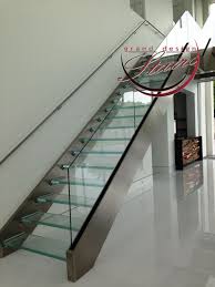 Wood monostringer staircase with structural glass. Glass Stairs Glass Steps Structural Glass Railings