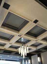 Modern Coffered Ceiling With Contemporary Chandelier In Lobby Of Historic Building Coffered Ceiling Commercial Interior Design Coffered Ceiling Design