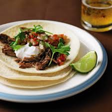 When fish is finished cooking, flake with a fork and set aside. Fish Tacos With Lime Cilantro Crema Recipe Myrecipes