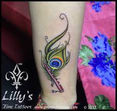 137 feather tattoo with name; Image1 Feather Tattoo Design Tattoo Designs Wrist Tattoos