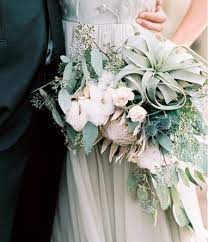 An Asymmetrical Cascading Bouquet Of Seeded Eucalyptus Silver Dollar Eucalyptus Pink King Protea Xe Wedding Flowers Wedding Bouquets Wedding Bridal Bouquets