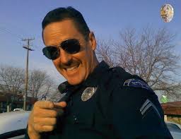 Smiles are POWERFUL and today is National SMILE day. We hope this kind  gesture makes you smile. Officer Ricky Zodrow is the School Resource  Officer at Nampa High School. Braxton is a