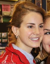Lana Del Rey ditches her gold tooth cap for a silver sparkly version