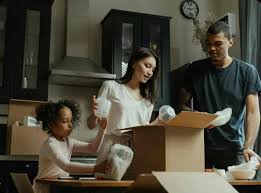 Mauritian family preparing for a less stressful home move with labelled boxes