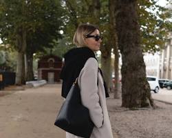 Image of Winter outfit with chunky knit sweater, skinny jeans, and boots