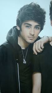 that hairstyle makes his head look small. handsome, but small. :)